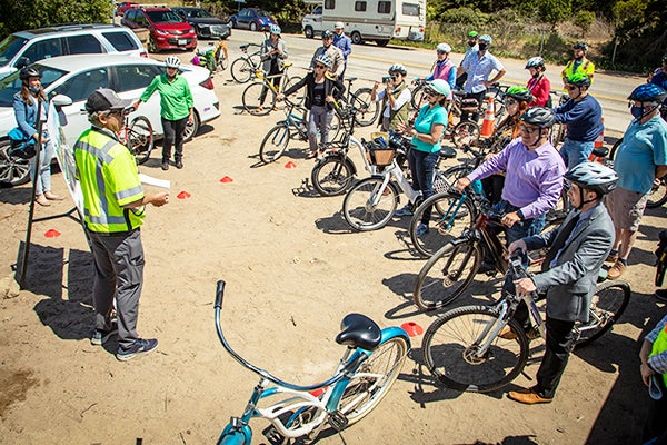 Bikers gather on the side of the road