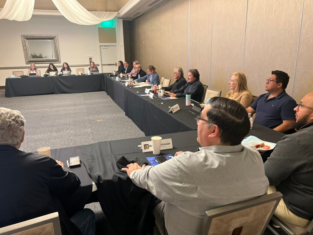 Measure A Citizens Oversight Committee members sitting around a table in conference room.