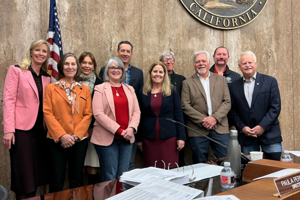 Image of SBCAG Board Members at a meeting in Santa Barbara County Board of Supervisors Hearing Room.
