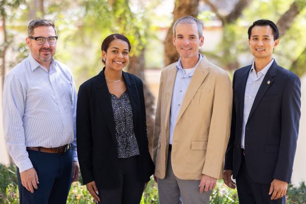Team photo of three people in the planning division.